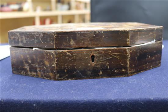 A Regency elongated octagonal games box, parquetry veneered, containing approximately 360 etched mother